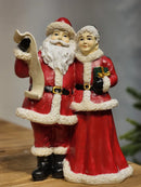 PAPAI NOEL COM MAMÃE NOEL COM LISTA EM RESINA 23,5CM